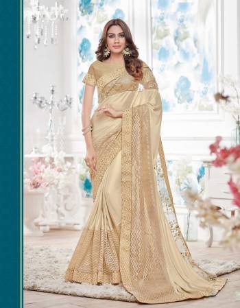 Look Beautiful In This Beige Colored Saree Paired With Beige Colored Blouse. This Saree Is Fabricated On Lycra Paired With Brocade  Fabricated Blouse.Buy It Now. Buy This Saree Now.