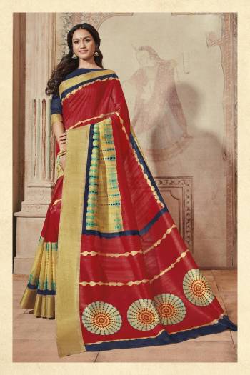 Adorn The Angelic Look Wearing This Saree In Red Color Paired With Contrasting Navy Blue Colored Blouse. This Saree And Blouse Are Fabricated On Art Silk Beautified With Prints Over It. Buy This Saree Now.