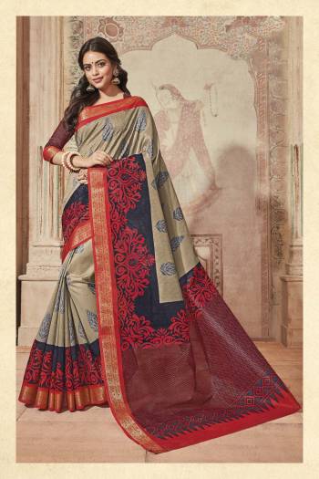 Rich Looking Saree Is Here With This Saree In Grey And Red Color Paired With Red And Blue Colored Blouse. This Saree And Blouse Are Fabricated On Art Silk Beautified With Bold And Small Prints. 