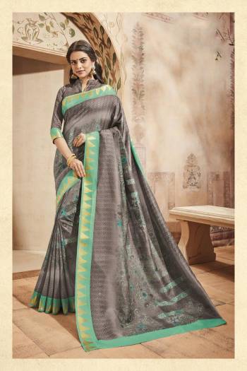 Simple and Rich Looking Saree Is Here With This Saree In Grey Color Paired With Grey Colored Blouse. This Saree And Blouse Are Fabricated On Art Silk Beautified With Beautified With Lines And Floral Prints. 