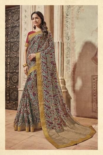 Go Colorful Wearing This Saree In Multi Color Paired With Contrasting Maroon Colored Blouse. This Saree And Blouse Are Fabricated On Art Silk. It Is Light Weight And Easy To Carry All Day Long.