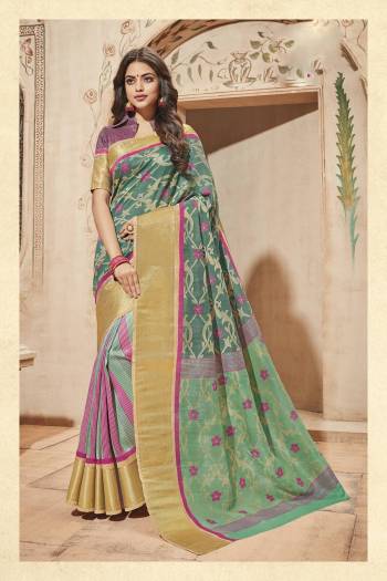 Grab This Saree In Green Color Paired With Contrasting Grey And Pink Colored Blouse. This Saree And Blouse Are Fabricated On Art Silk Beautified With Prints. Buy This Pretty Saree Now.