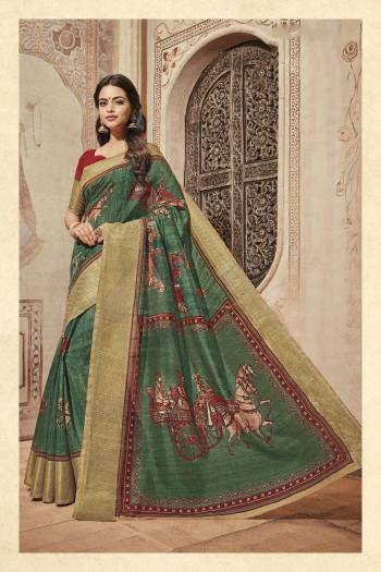 Go Traditional Wearing This Saree In Green Color Paired With Contrasting Maroon Colored Blouse. This Saree And Blouse Are Fabricated On Art Silk Beautified With Prints All Over It. Buy This Saree Now.