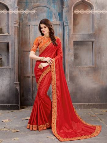 Adorn The Angelic Look Wearing This Saree In Red Color Paired With Contrasting Orange Colored Blouse. This Saree Is Fabricated O n Satin Silk Paired With Art Silk Fabricated Blouse. It Has Emboidery Over The Blouse And Saree Lace Border. 