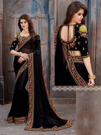 Enhance Your Beauty Wearing This Designer Saree In Black Color Paired With Black Colored Blouse. This Saree Is Fabricated On Chiffon Paired With Art Silk Fabricated Blouse. It Is Beautified With Multi Colored Embroidery Over The Blouse And Saree Lace Border.