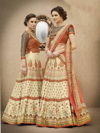 Adorn A Proper Traditional And Rich Look Wearing This Designer Lehenga Choli In Orange And Grey Colored Blouse Paired With Cream Colored Lehenga And Peach Colored Dupatta. Its Blouse And Lehenga Are Fabricated On Banarasi Art Silk Paired With Chiffon Dupatta. It Is Beautified With Digital Prints And Stone Work. Get Its Yoke And Skirt Joined To Make It A Gown. Buy Now.