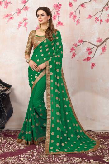 Celebrate This Festive Season Wearing This Saree In Green Color Paired With Golden Colored Blouse. This Saree Is Fabricated On Georgette Paired With Brocade Fabricated Blouse. It Is Light Weight And Easy To Carry All Day Long.