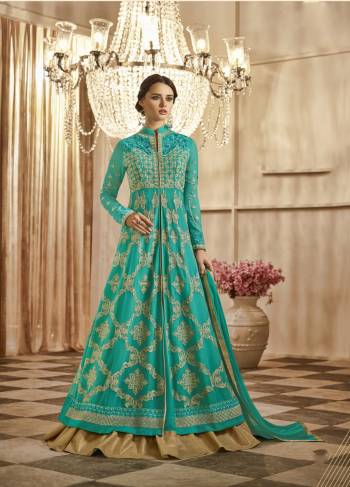 Add This New Shade In Blue With This Pretty Indo-Western Suit In Turquoise Blue Colored Top Paired With Turquoise Blue Colored Lehenga And Dupatta. Its Top And Lehenga Are Fabricated On Georgette Paired With Chiffon Dupatta. It Is Beautified With Heavy Embroidery All Over The Top.