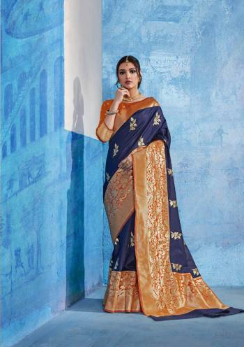 For An Attractive Personality, Grab This Saree In Navy Blue Color Paired With Contrasting Orange Colored Blouse. This Saree Is Fabricated On Handloom Art Silk Paired With Art Silk Fabricated Blouse. This Saree Is Beautified With Weave In Bold Designs. Buy Now.