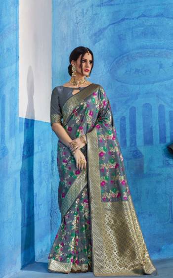 Flaunt Your Rich And Elegant Taste Wearing This Saree In Grey Color Paired With Grey Colored Blouse. This Saree Is Fabricated On Handloom Art Silk Paired With Art Silk Fabricated Blouse Beautified With Multi Colored Weave. Buy This Saree Now.