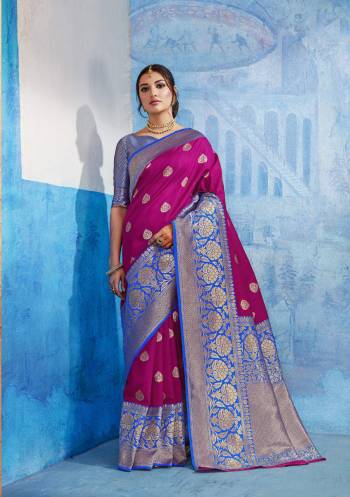 This Festive Season, Grab This Pretty Saree In Dark Pink Color Paired With Blue Colored Blouse. This Saree Is Fabricated On Handloom Art Silk Paired With Art Silk Fabricated Blouse. This Is Beautified With Simple Weave All Over.