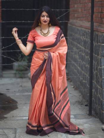 Add This Trendy Looking Peach Colored Saree Paired With Peach Colored Blouse. This Saree And Blouse Are Fabricated On Slub Cotton. This Plain Saree Is The Most Running Trend This Season. Buy This Saree Now.