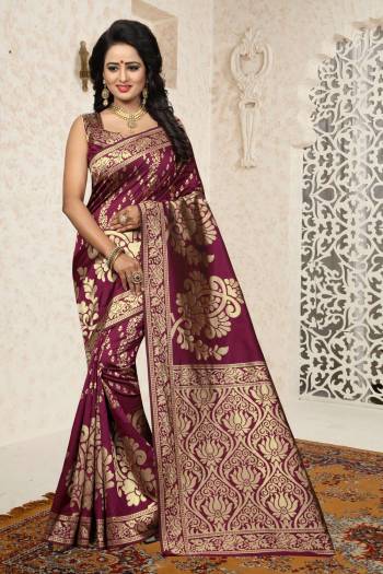 Add This Lovely Shade To Your Wardroba With This Saree In Wine Color Paired With Wine Colored Blouse. This Saree And Blouse Are Fabricated On Banarasi Art Silk Beautified With Rapier Jacquard Work. This Saree Is Durable And Easy To care For.