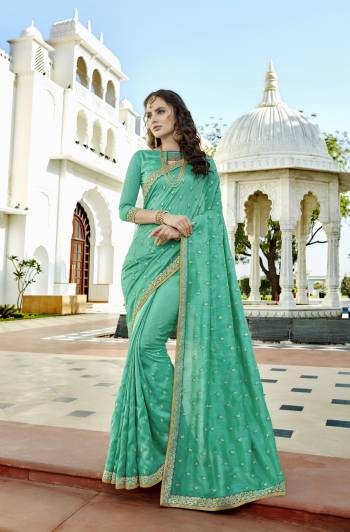 Add This Pretty Shade In Green With This Saree In Sea Green Color Paired With Sea Green Colored Blouse. This Saree And Blouse Are Fabricated On Soft Silk Beautified With Embroidered Small Motifs. Buy This Saree Now.