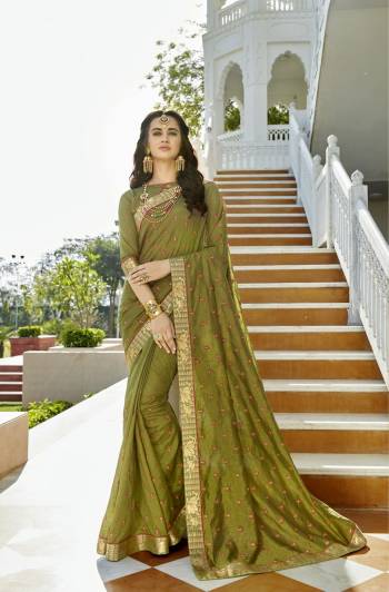 New And Unique Shade Is Here With This Saree In Olive Green Color Paired With Olive Green Colored Blouse. This Saree And Blouse Are Fabricated On Soft Silk. Its Fabric Is Light In Weight And Ensures Superb Comfort All Day Long. 