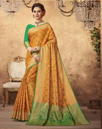 Celebrate This Festive Season Wearing This Yellow Colored Saree Paired With Contrasting Green Colored Blouse. This Saree And Blouse Are Fabricated On Art Silk Beautified With Weave All Over It. This Saree Is Durable And Easy To Carry All Day Long.