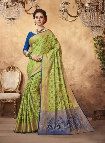 A Very Pretty Shade Is Here In Green With This Light Green Colored Saree Paired With Contrasting Blue Colored Blouse. This Saree And Blouse Are Fabricated On Art Silk Beautified With Weave All Over The Saree Making It Attractive. Buy Now.