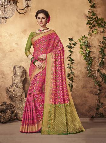 Add Colors To Your Beauty Wearing This Saree In Pink Color Paired With Contrasting Olive Green Colored Blouse. This Saree And Blouse Are Fabiricated On Art Silk Beautified With Multi Colored Weave. It Is Durable And Care For. Buy This Saree Now.