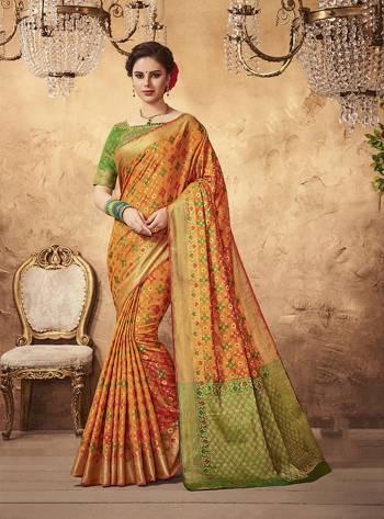 Shine Bright Wearing This Saree In Orange Color Paired With Contrasting Green Colored Blouse. This Saree And Blouse Are Fabricated On Art Silk Beautified With Weave All Over It. Its attractive Color Combination Will earn You Lots Of Compliments From Onlookers.