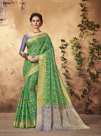 Grab This Pretty Saree For Your Festive Or Semi-Casual Wear In Green Color Paired With Contrasting Blue Colored Blouse. This Saree And Blouse Are Fabricated On Art Silk Beaurified With Weave. It Is Light Weight And Easy To Carry All Day Long.