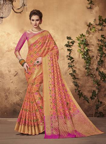 Shine Bright Wearing This Saree In Orange Color Paired With Contrasting Pink Colored Blouse. This Saree And Blouse Are Fabricated On Art Silk Beautified With Weave All Over It. Its attractive Color Combination Will earn You Lots Of Compliments From Onlookers.