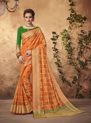 Shine Bright Wearing This Saree In Orange Color Paired With Contrasting Green Colored Blouse. This Saree And Blouse Are Fabricated On Art Silk Beautified With Weave All Over It. Its attractive Color Combination Will earn You Lots Of Compliments From Onlookers.