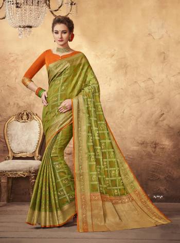 Perfect Traditonal Combination Is Here With This Saree In Green Color Paired With Contrasting Orange Colored Blouse. This Saree And Blouse Are Fabricated On Art Silk Beautified With Weave All Over. Its Fabrics Ensures Superb Comfort All Day Long. Buy Now.