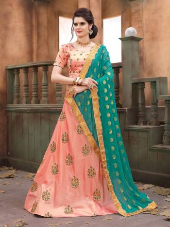 A Must Have Color In Every Womens Wardrobe Is Here. Grab This Lovely And The Most Running Peach Colored Lehenga Choli Paired With Contrasting Turquoise Blue Colored Dupatta. Its Blouse And Lehenga Are Fabricated On Soft Silk Paired With Chiffon Fabricated Dupatta. Its HAs Pretty Embroidered Motifs All Over. Buy Now.