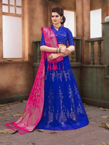 Shine Bright Wearing This Royal Blue Colored Lehenga Choli Paired With Contrasting Dark Pink Colored Dupatta. Its Blouse And Lehenga Are Fabricated On Banarasi Art Silk Paired With Banarasi Art Silk Dupatta. Its All Three Fabrics Enures Superb Comfort All Day Long. Buy Now.