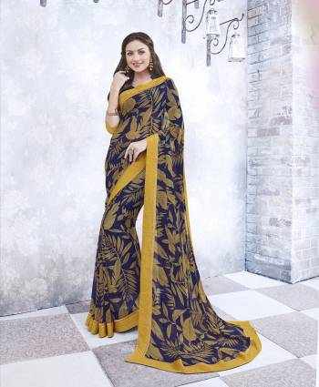 Bright Combination Is Here With This Navy Blue And Yellow Colored Saree Paired With Navy Blue Colored Blouse. This Saree And Blouse Are Fabricated On Georgette Beautified With Bold Prints. Get This Pretty Light Weight Saree Now.