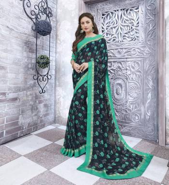 Enhance Your Personality Wearing This Saree In Navy Blue Color Paired With Turquoise Blue Colored Blouse. This Saree And Blouse Are Fabricated On Georgette Beautified With Simple Floral Prints. It Is Easy To Carry And Soft Towards Skin. Buy Now.