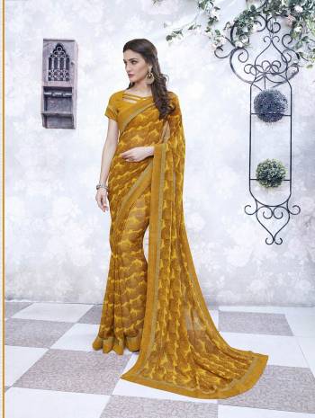 Earn Lots Of Compliments Wearing This Saree In Musturd Yellow Color Paired With Musturd Yellow Colored Blouse. This Saree And Blouse Are Fabricated On Georgette Beautified With Prints All Over The Saree. Buy This Saree Now.