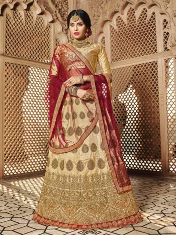 Flaunt Your Rich And Elegant Taste Wearing This Designer Lehenga Choli In Beige Color Paired With Maroon Colored Dupatta. This Royal Combination Will Earn You Lots Of Compliments From Onlookers. Its Blouse And Lehenga Are Fabricated On Art Silk Paired With Net Fabricated Dupatta. Buy Now.