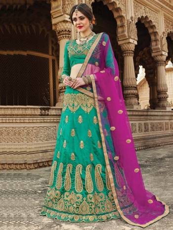 Grab This Designer Lehenga Choli In Green Color Paired With Contrasting Magenta Pink Colored Dupatta. Its Blouse And Lehenga Are Fabricated On Art Silk Paired With Net Fabricated Dupatta. This Lehenga Choli Is Light Weight And Ensures Superb Comfort All Day Long. Buy Now.