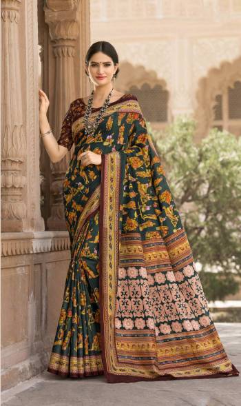 Dark Colors Always Gives An Attractive Look To Your Personality, So Grab This Saree In Dark Green Color Paired With Brown Colored Blouse. This Saree And Blouse Are Fabricated On Tussar Art Silk Beautified With Prints All Over. It Is Light Weight And Easy To Carry All Day Long.