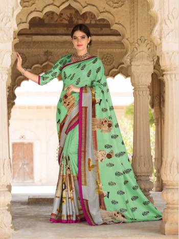 You Will Definitely Earn Lots Of Compliments Wearing This Saree In Light Green Color Paired With Light Green Colored Blouse. This Saree And Blouse Are Fabricated On Tussar Art Silk Beautified With Prints. This Fabric Gives A Rich And Elegant Look To Your Personality. Buy It Now.