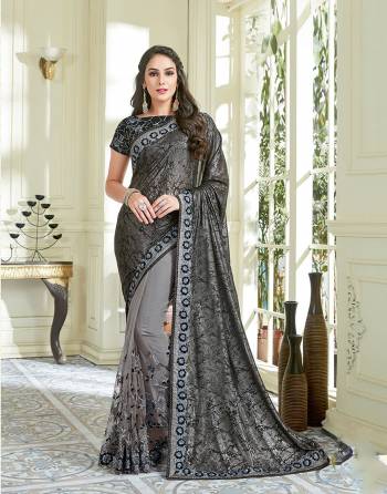 Let your mood be defined by everything urbane and stylish in this beautiful black saree with tonal embroidery details and look enchantingly beautiful.