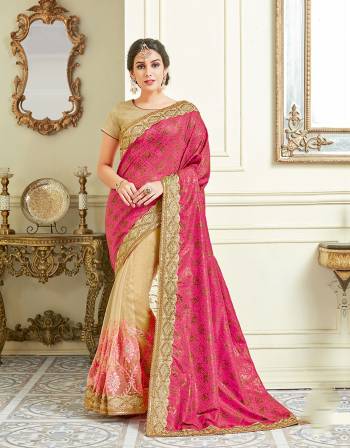 Get your ethnic look just right in this feminine and appealing pink half-half stlye saree adorned with conventional embroidery details. 