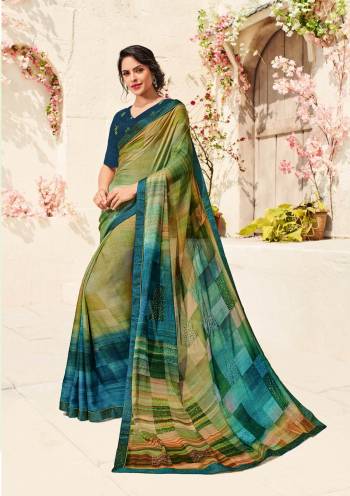 Go Colorful Wearing This Saree In Multi Color Paired With Dark Blue Colored Blouse. This Saree Is Fabricated On Chiffon Crepe Paired With Art Silk Fabricated Blouse. It Is Beautified With Prints All Over. This Elegant Looking Saree Will Earn You Lots Of Compliments From Onlookers. Buy Now.