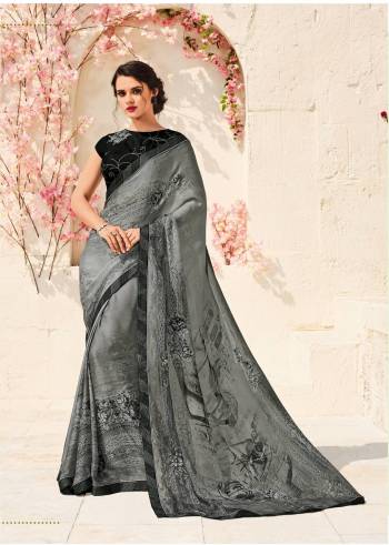 Flaunt Your Rich And Elegant Taste Wearing This Saree In Grey Color Paired With Black Colored Blouse. This Saree Is Fabricated On Chiffon Crepe Paired With Art Silk Fabricated Blouse. Its Fabric IS Soft Towards Skin And Ensures Superb Comfort All Day Long.