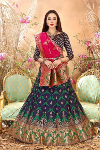 Enhance Your Personality Wearing This Lehenga Choli In Navy Blue Color Paired With Contrasting Dark Pink Colored Blouse. This Lehenga Choli And Dupatta Are Fabricated On Jacquard Silk Beautified With Weave. Buy This Lovely Piece Now.