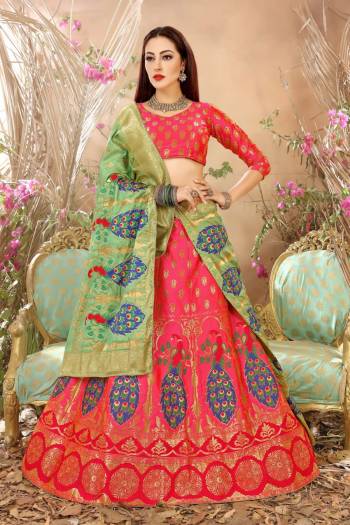 Look Pretty In This Pink Colored Lehenga Choli Paired With Contrasting Green Colored Dupatta. Its Blouse And Lehenga Are Fabricated On Jacquard Silk Beautified With Multi Colored Weave. It Is Light Weight And Easy To Carry All Day Long.