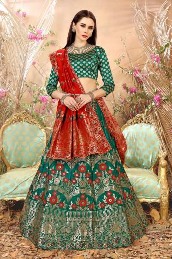 Add This Lovely Shade In Green With This Lehenga Choli In Pine Green Color Paired With Contrasting Red Colored Dupatta. Its Blouse, Lehenga And Dupatta Are Fabricated On Jacquard Silk Beautified With Weave. It Is Light Weight And Ensures Superb Comfort All Day Long.