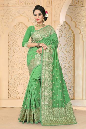 Add This Lovely Saree To Your Wardrobe In Green Color Paired With Green Colored Blouse. This Saree And Blouse Are Fabricated On Art Silk Beautified With Jari Embroidery And Stone Work. This Saree IS Light In Weight And Easy To Carry All Day Long.