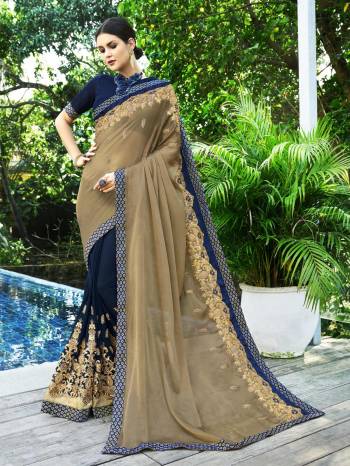 New And Unique Combination Is Here With This Designer Saree In Pastel Brown And Navy Blue Color Paired With Navy Blue Colored Blouse. This Pretty Saree Is Fabricated On Chiffon And Georgette Paired With Art Silk Fabricated Blouse. Its Fabrics are Light Weight And Ensures Superb Comfort Throughour The Gala. 