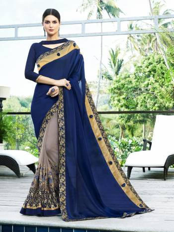 One Of The Best Color Combination Is Here With This Designer Saree In Dark Blue And Grey Color Paired With Dark Blue Colored Blouse.This Saree Is Fabricated On Chiffon And Georgette Paired With Art Silk Fabricated Blouse. Wear This At The Next Party You Attend And Earn Lots Of Compliments From Onlookers.