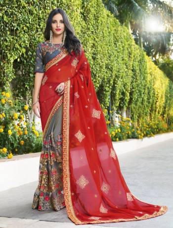 Adorn The Elegant Angelic Look Wearing This Saree In Red And Grey Color Paired With Grey Colored Blouse. This Saree Is Fabricated On Georgette And Net Paired With Art Silk Fabricated Blouse. It Is Beautified With Heavy Embroidery All Over. Buy This Designer Saree Now.