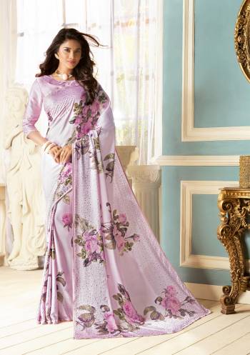 A Very Pretty Shade In Purple Is Here With This Saree In Lavendor Color Paired With Lavendor Colored Blouse. This Saree And Blouse Are Fabricated On Fancy Fabric Beautified With Bold Prints And Stone Work. Buy This Saree Now.