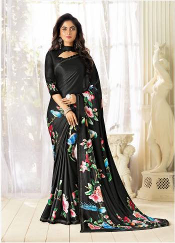 For A Bold and Beautiful Look, Grab This Designer Black Colored Saree Paired With Black Colored Blouse. This Saree And Blouse Are Fabricated On Fancy Fabric Beautified With Multi Colored Floral Prints And Stone Work. 