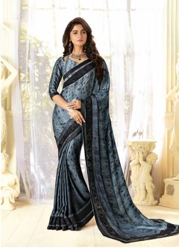 Color That Suits Every Age Group Is Here, Grab This Designer Saree In Grey Color Paired With Grey Colored Blouse. This Saree And Blouse Are Fabricated On Fancy Fabric Beautified With Prints And Stone Work. This Saree Is Light Weight And Easy To Carry All Day Long. Buy It Now.